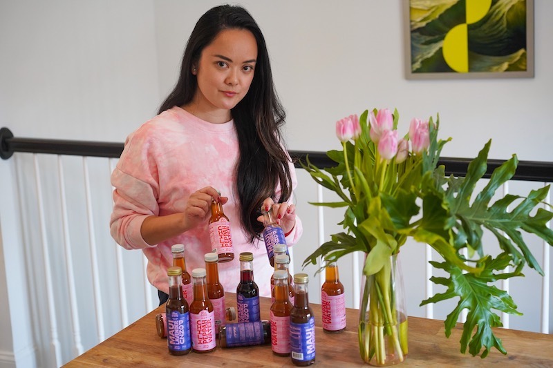 Poi Dog founder Kiki Aranita presenting a selection of the company’s sauces.