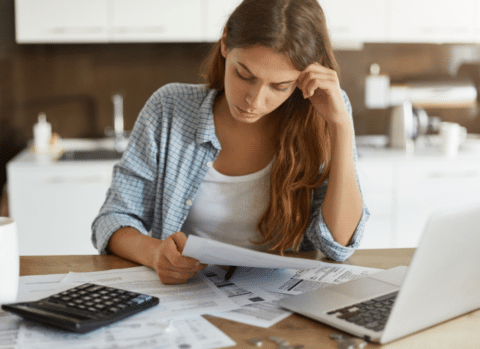 businesswoman going over bills