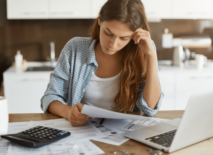 businesswoman going over bills
