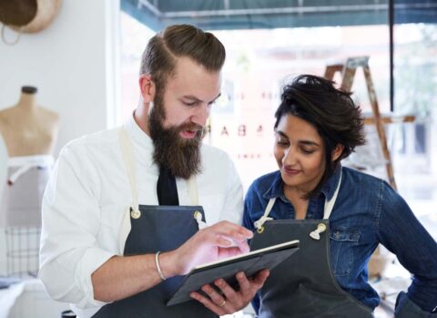 small business owner managing using cash flow app