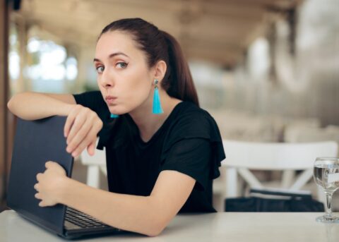 Woman protecting her laptop computer