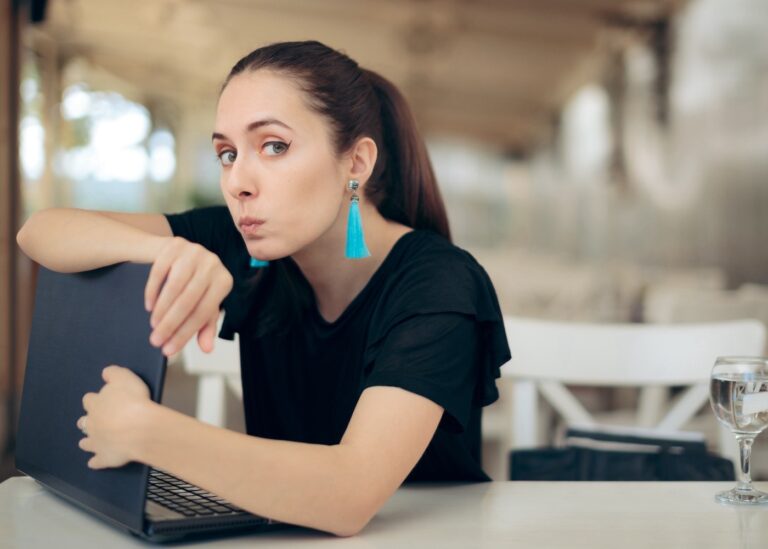 Woman protecting her laptop computer