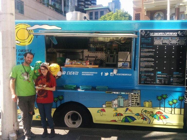 Rotem Tal and his sister in front of the food truck he owned before joining Melio.