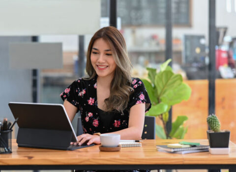 A small business owner reviewing invoices before sending payments.