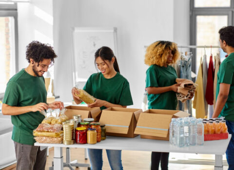 Volunteers for a nonprofit packing care packages.