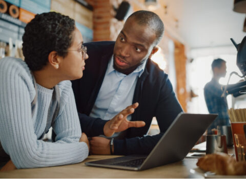 An experienced business owner mentoring a young entrepreneur.