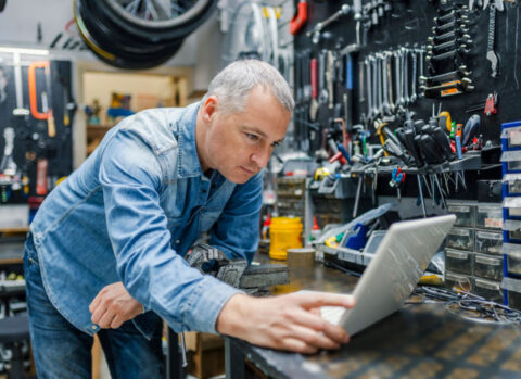 A bike shop owner reviewing his business assets.