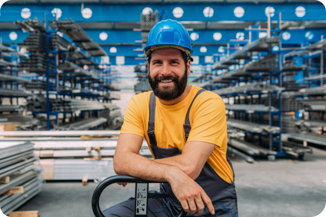 A business owner in the logistics industry in a storage warehouse.