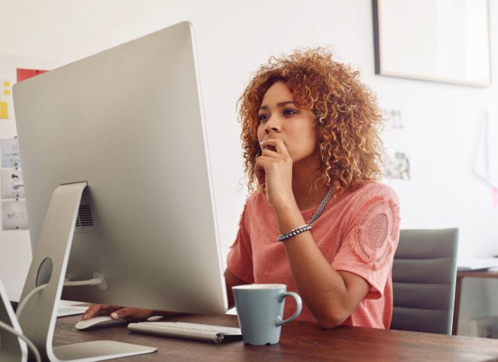 A small business owner using a computer to send an ACH payment to a vendor.