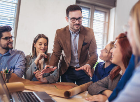 A marketing expert offering professional services presents a strategy to a small business client.
