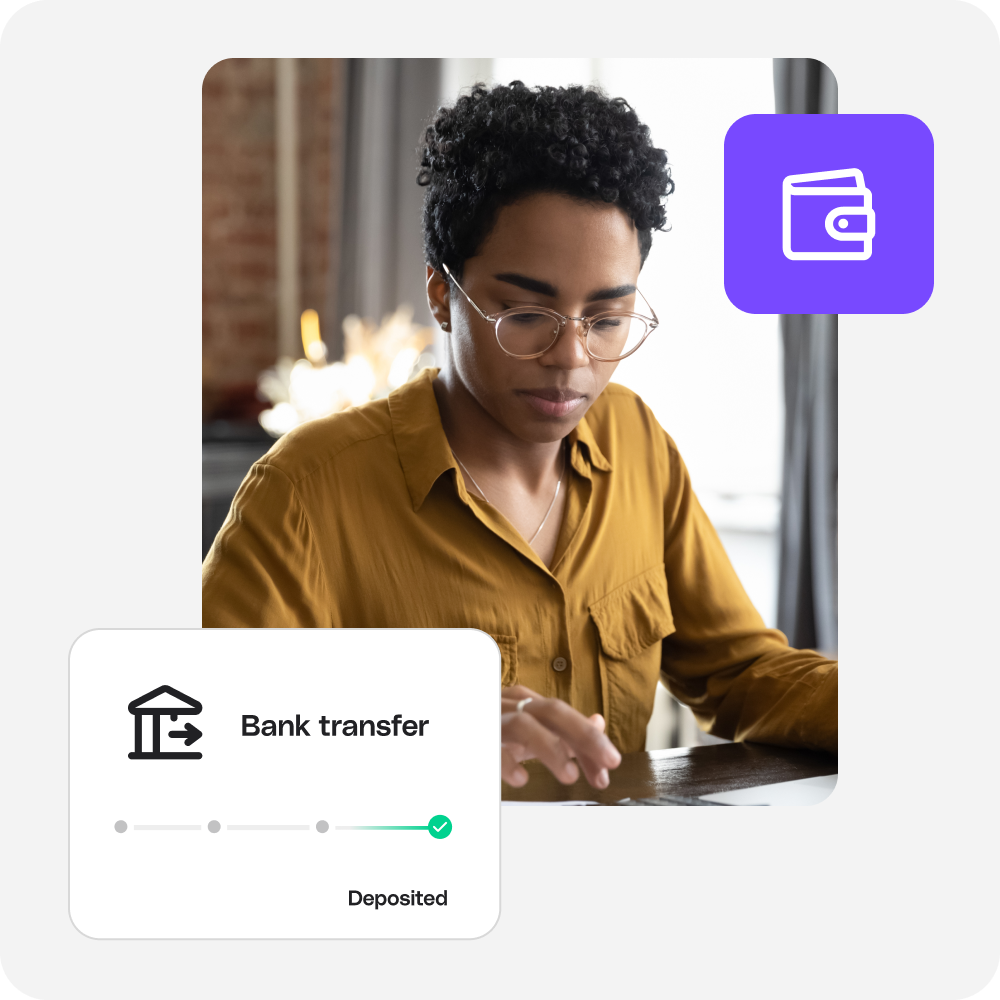 A business owner paying bills online with ACH bank transfer
